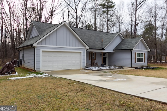 view of front facade with a garage and a front yard