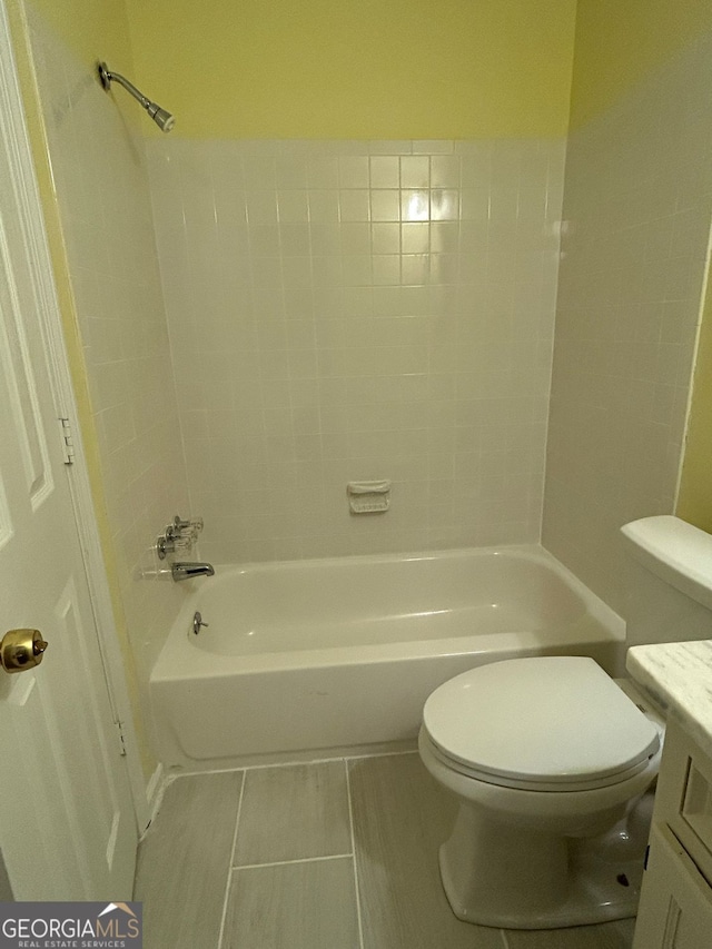 full bathroom with tile patterned floors, vanity, toilet, and shower / bath combination