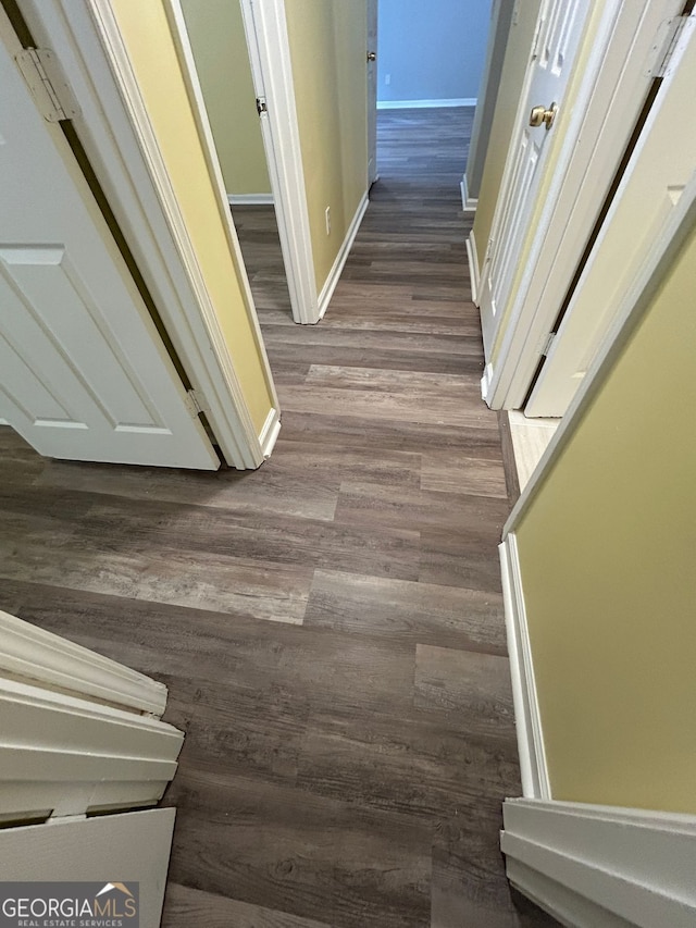 corridor with wood-type flooring