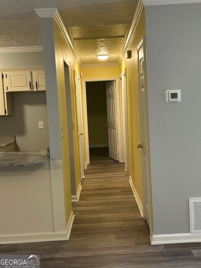 hall featuring dark hardwood / wood-style flooring and ornamental molding