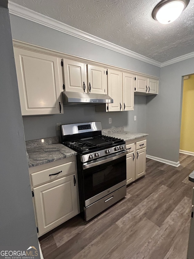 kitchen with ornamental molding, stainless steel range with gas cooktop, light stone countertops, and a textured ceiling