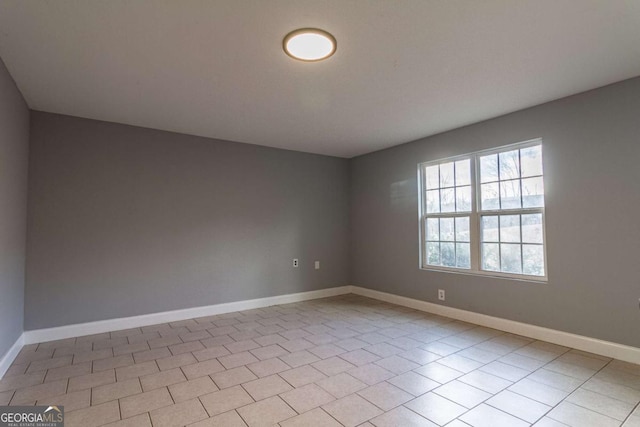 tiled empty room with baseboards