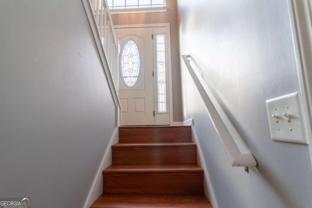 staircase featuring wood finished floors