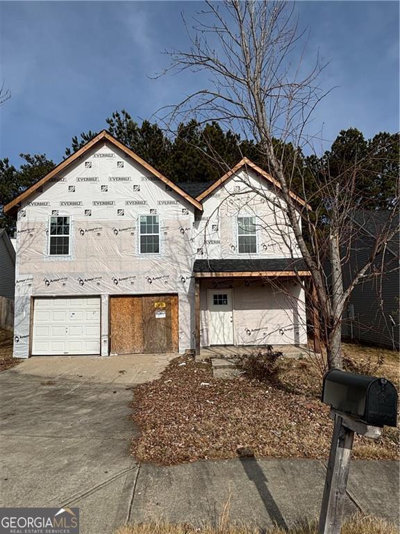 view of front of property with a garage