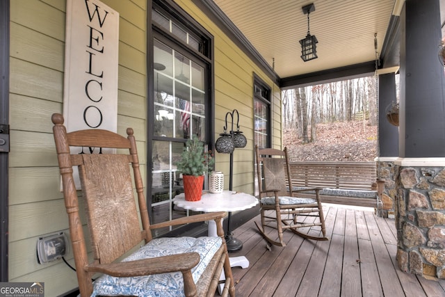 wooden terrace featuring a porch