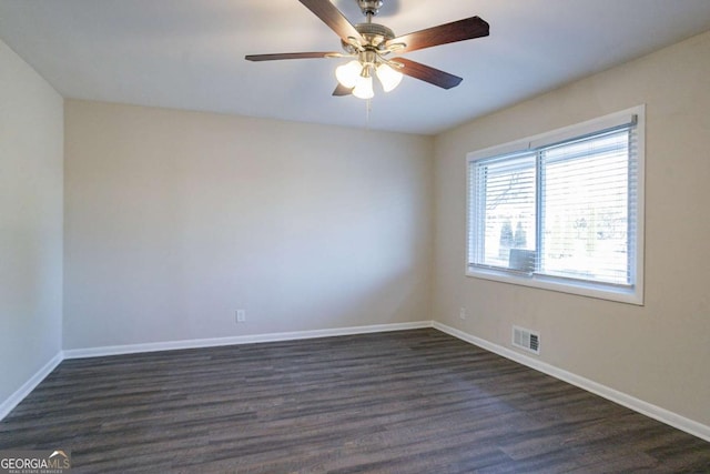 unfurnished room with ceiling fan and dark hardwood / wood-style flooring