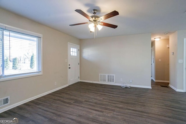 interior space with ceiling fan and dark hardwood / wood-style floors