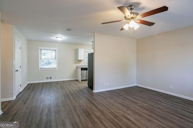 unfurnished living room with dark wood-type flooring and ceiling fan