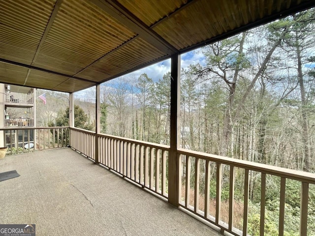 unfurnished sunroom with plenty of natural light