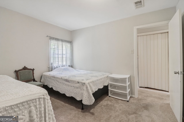 bedroom with light colored carpet