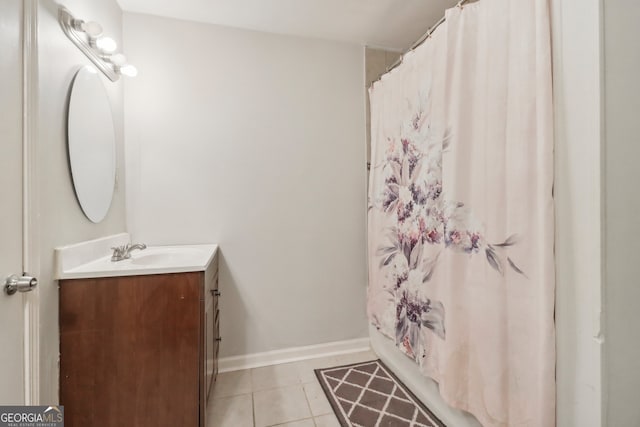 bathroom with tile patterned floors and vanity