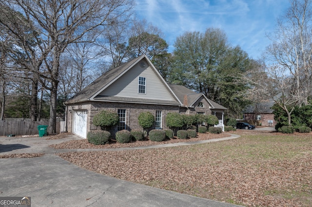 view of side of home featuring a garage