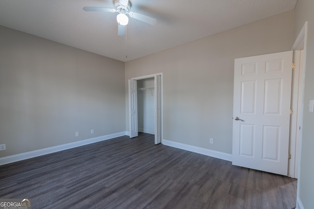 unfurnished bedroom featuring dark wood-type flooring, ceiling fan, a closet, and a textured ceiling