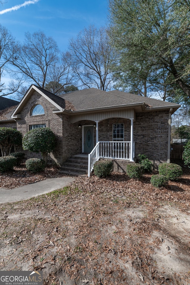 ranch-style house featuring a porch