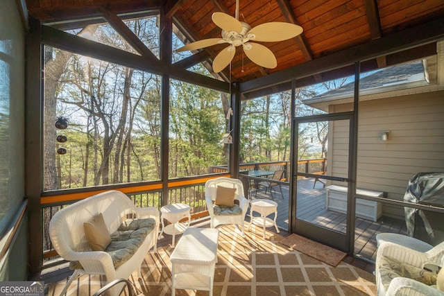 sunroom / solarium with vaulted ceiling and ceiling fan