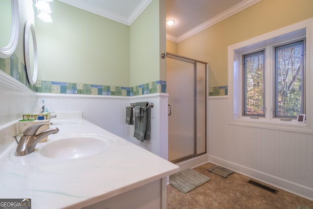 bathroom featuring crown molding, tile patterned floors, walk in shower, and vanity