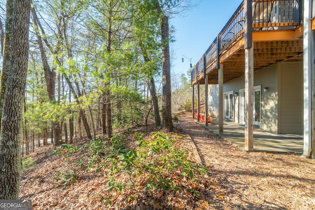 view of yard featuring a wooden deck