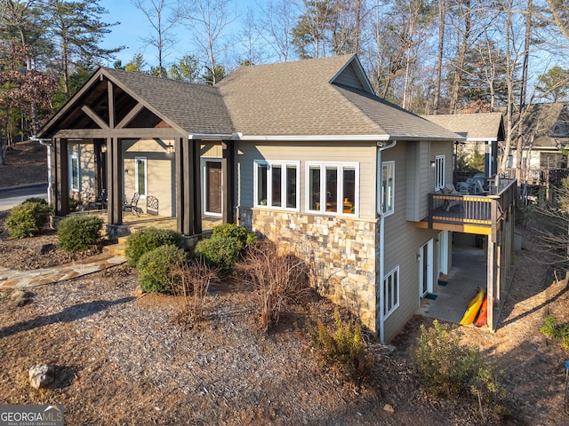 view of front of home featuring a wooden deck