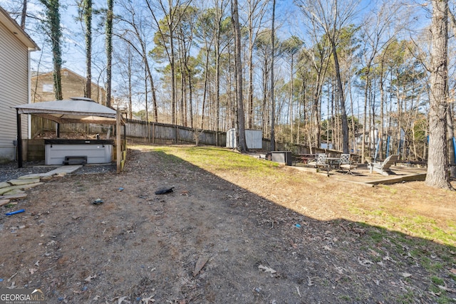 view of yard with a gazebo and a jacuzzi