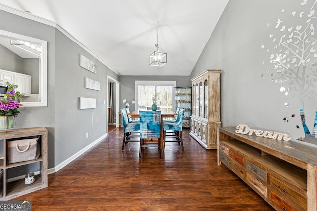 dining area featuring crown molding, high vaulted ceiling, an inviting chandelier, and dark hardwood / wood-style flooring