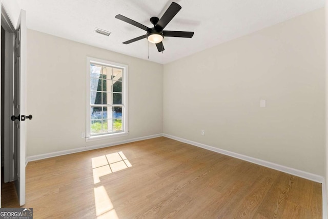 unfurnished room featuring ceiling fan and light wood-type flooring