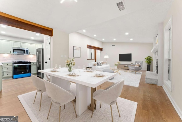 dining room with light wood-type flooring