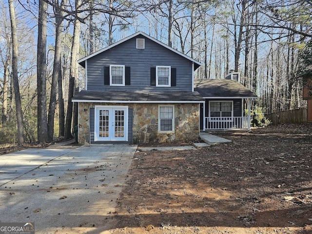 back of house featuring a porch and french doors