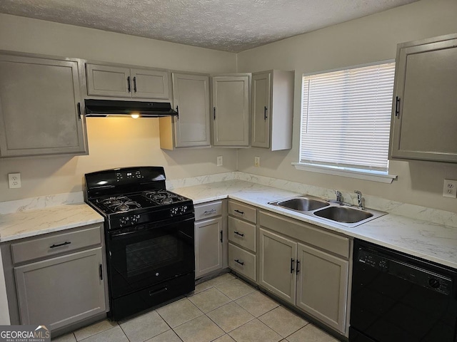 kitchen featuring gray cabinets, sink, and black appliances