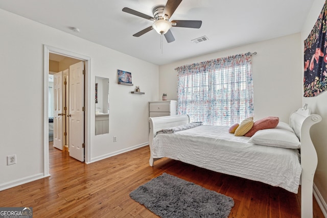 bedroom featuring hardwood / wood-style flooring and ceiling fan