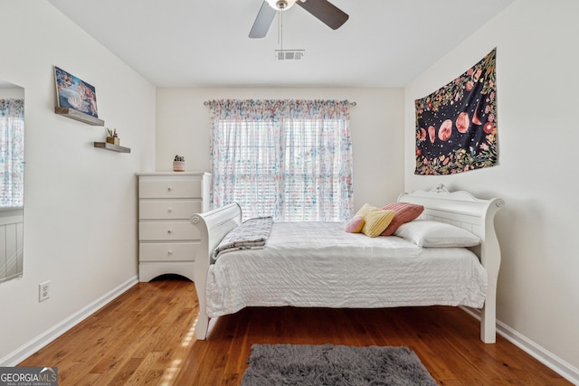 bedroom with wood-type flooring and ceiling fan