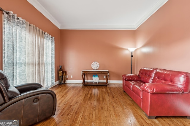 living room with ornamental molding and hardwood / wood-style floors