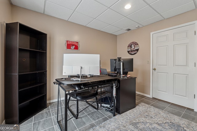 office space with a drop ceiling