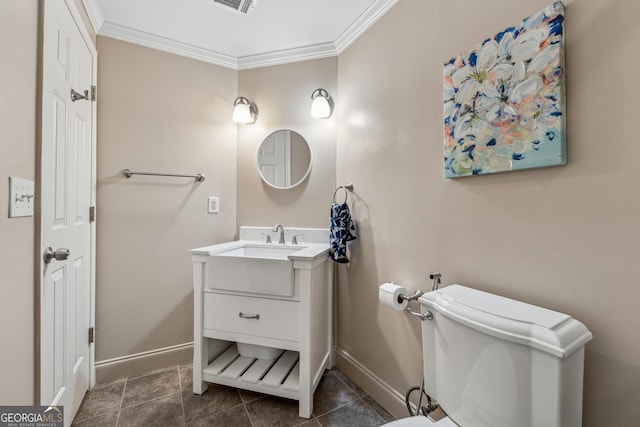 bathroom featuring tile patterned floors, ornamental molding, toilet, and vanity