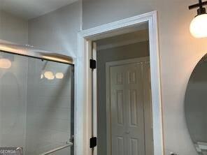 bathroom featuring walk in shower