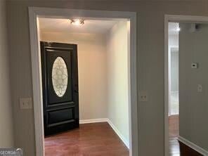 entryway with dark wood-type flooring