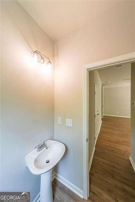 bathroom featuring wood-type flooring