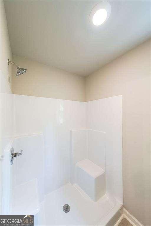 bathroom with walk in shower