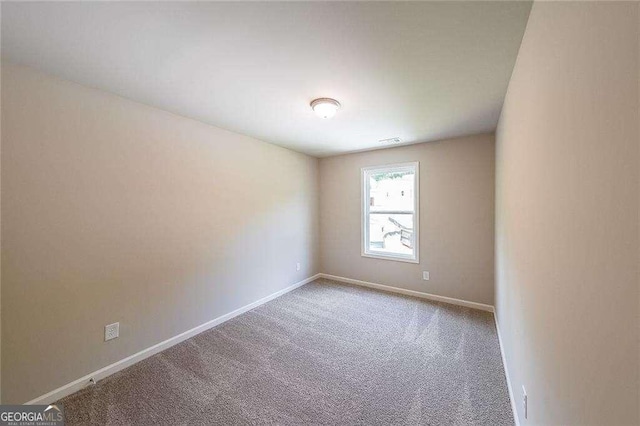 empty room featuring carpet flooring