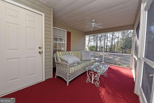 sunroom / solarium with ceiling fan and wooden ceiling