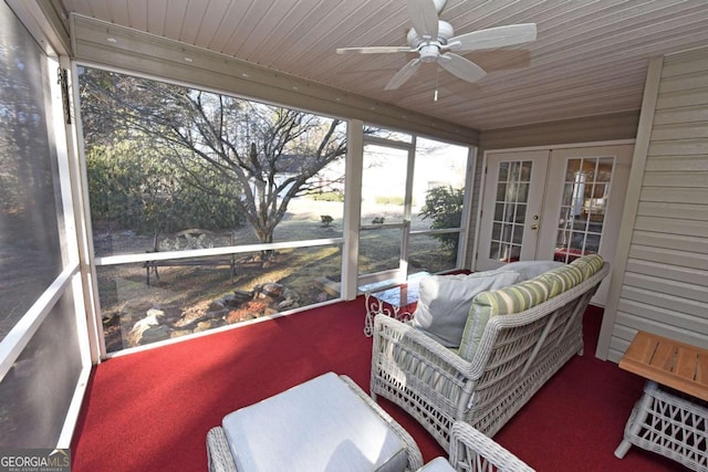 sunroom with ceiling fan, wood ceiling, and french doors