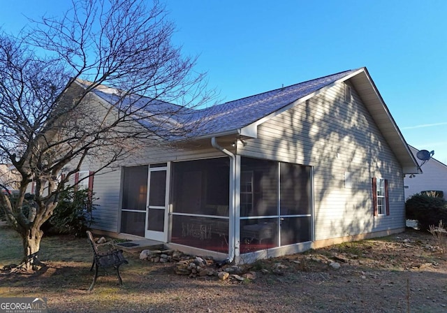 view of home's exterior featuring a sunroom