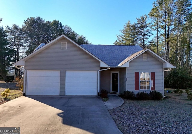 single story home featuring a garage