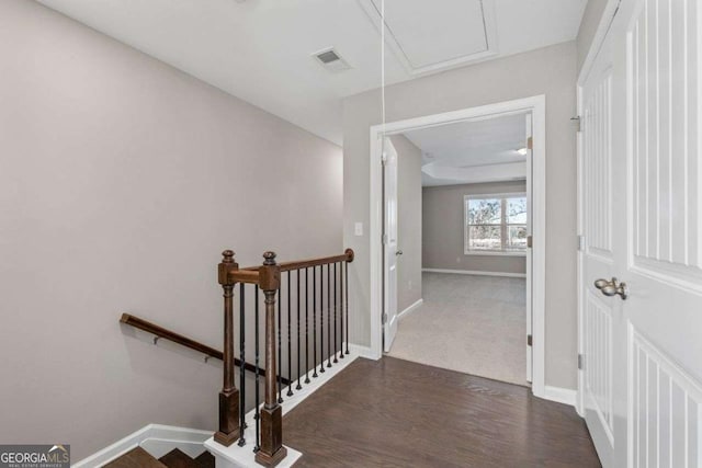 corridor with dark hardwood / wood-style floors