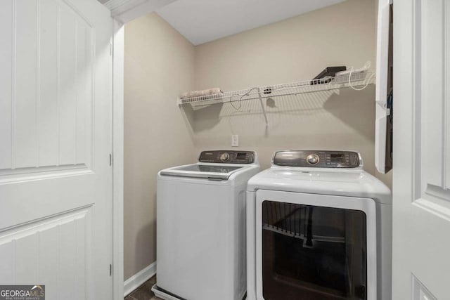 laundry room featuring separate washer and dryer