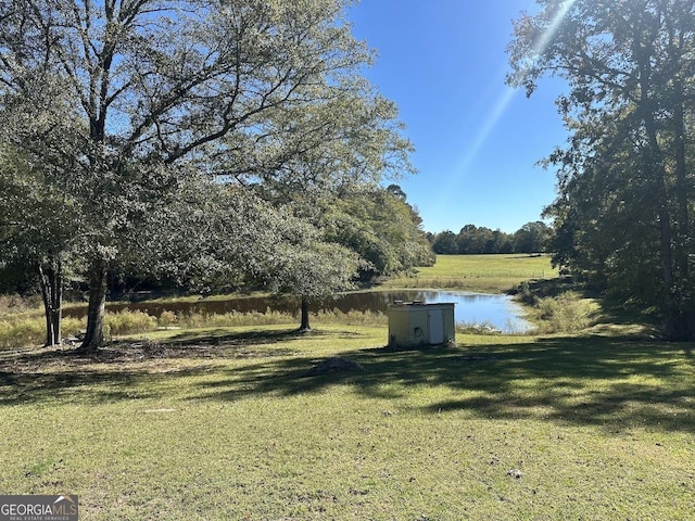 view of yard with a water view