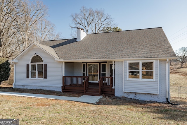 view of front of house featuring a front yard and covered porch