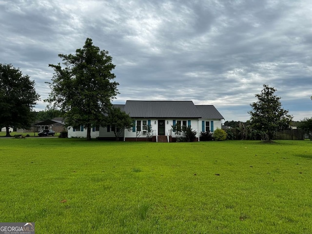 ranch-style home with a front yard