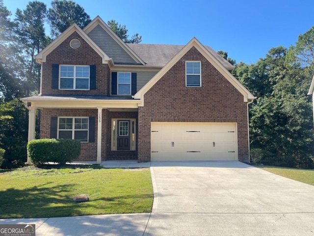 view of front of house with a garage and a front yard