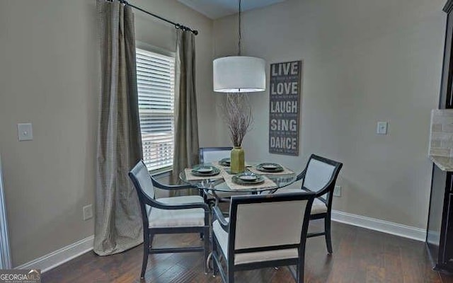 dining area with dark hardwood / wood-style floors