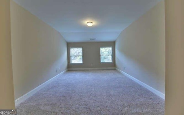 spare room with light colored carpet